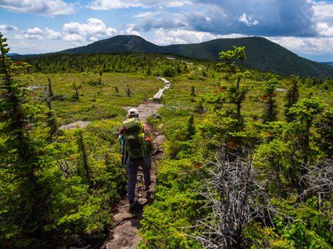 Hiker on Appalachian Trail in Maine trail development