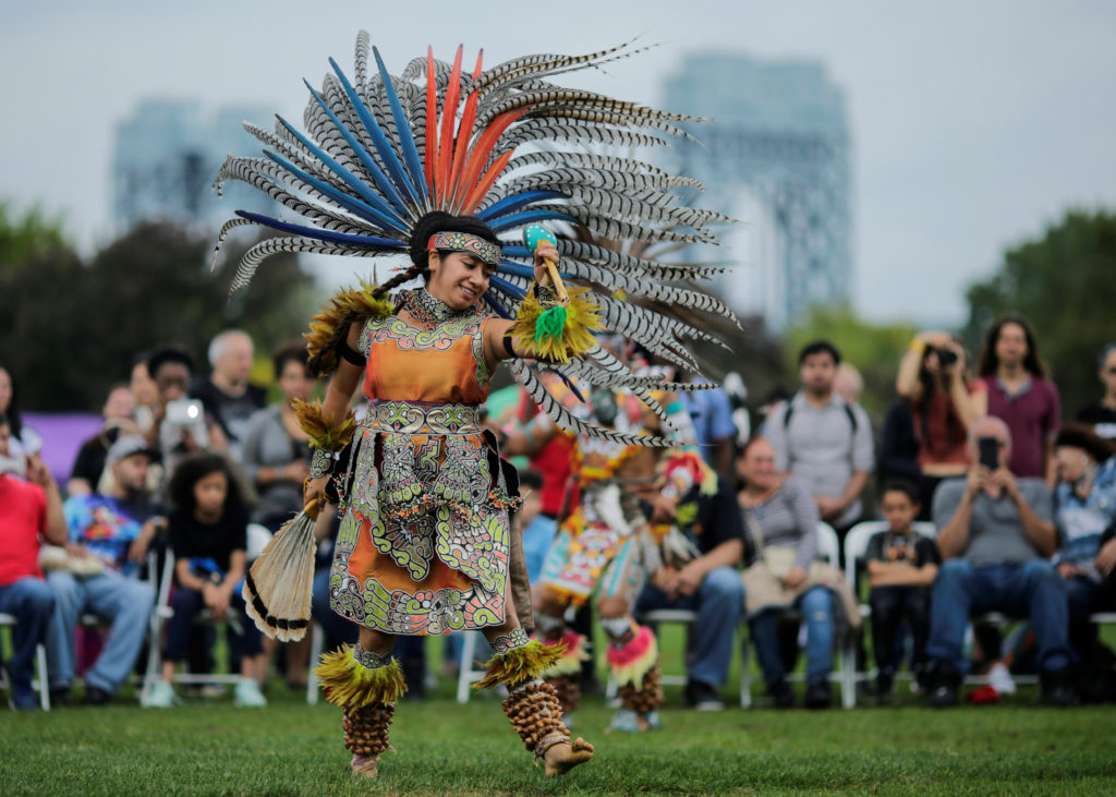 A reveller performs during a "pow-wow" celebrating the Indigenous Peoples' Day Festival in Randalls Island, in New York indigenous peoples' day