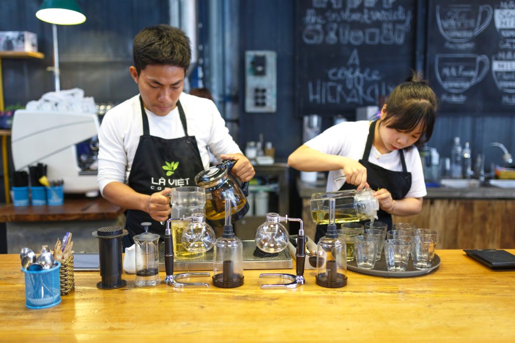 restaurant workers like these speciality coffee makers contribute meaningfully to the tourism industry